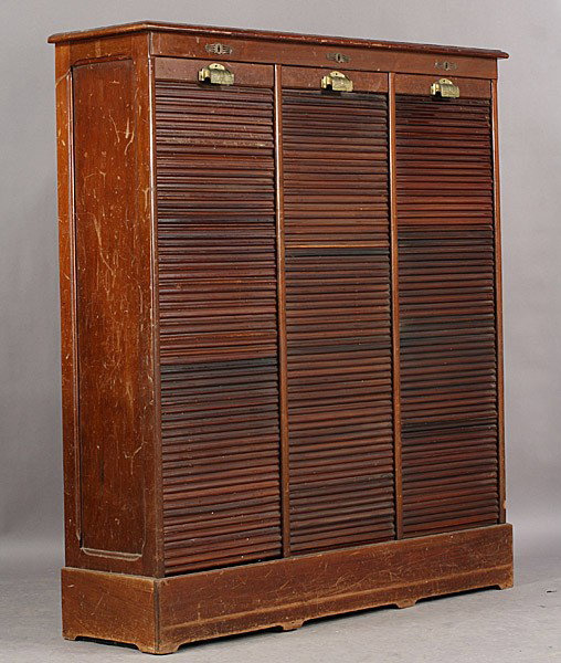 ANTIQUE VERTICAL FILE CABINET 3 TAMBOUR DOORS: Antique vertical file cabinet having three tambour closures and a fitted interior circa 1910. Ht: 59" Width: 53" Depth: 15" Terms & Conditions: PLEASE NOTE: All property shall be paid for by the purch