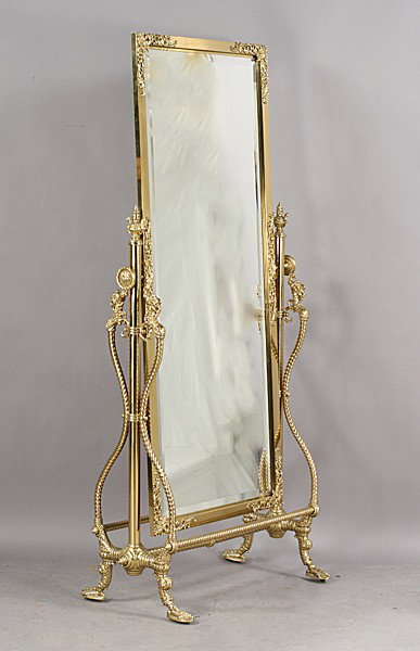 ANTIQUE VICTORIAN BRONZE SWIVEL CHEVAL MIRROR: Rare late Victorian bronze cheval mirror with a beveled glass mirror set into a swivel frame resting on a claw foot base circa 1900. Ht: 73" Width: 34" Terms & Conditions: PLEASE NOTE: All property sh