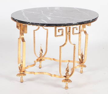 FRENCH GILT IRON TABLE MANNER POILLERAT CIRCA 1940: A French gilt iron marble top table in the manner of Gilbert Poillerat circa 1940. Ht: 30.5" Dia: 40"