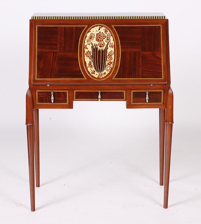 FRENCH ART DECO SLANT FRONT DESK KRASS CIRCA 1925: A French Art Deco slant front desk by Christian Krass circa 1925. The case being oak with inlays of bakelite, Indian rosewood and blond makassar ebony with silvered bronze hardware. Ht: 44" Wd: 33.5"