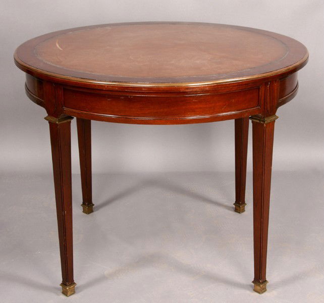 JANSEN STYLE LEATHER BRONZE CENTER TABLE NORDISKA: Labeled Nordiska Louis XVI style center table with inset leather top, bronze banding and bronze mounted tapered legs circa 1940. Ht: 29" Width: 37.5"