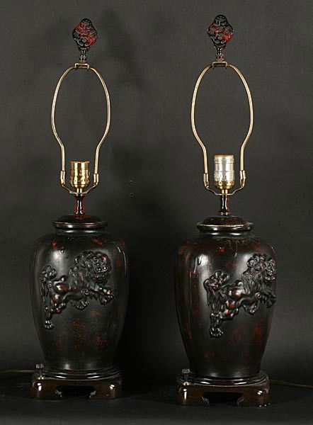 PR JAMES MONT VINTAGE MID CENT TABLE LAMPS ASIAN: Pair of James Mont Asian inspired metal table lamp lamps with relief decorated foo dogs and faux tortoise shell circa 1960. Ht: 25" Width: 6.5"