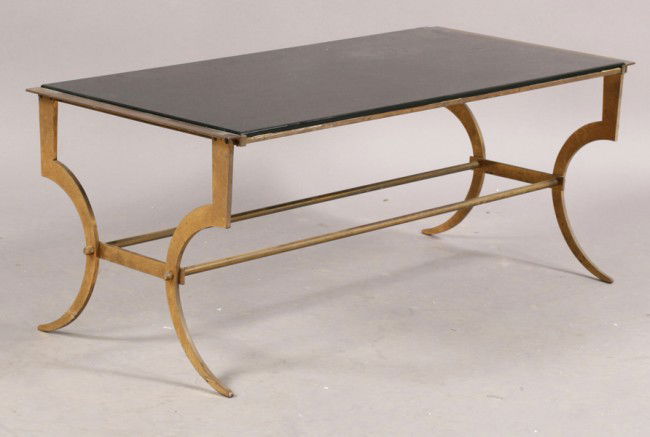 FRENCH BRONZE COFFEE TABLE BLACK GLASS TOP: A stylish French bronze coffee table having a black glass top supported on downswept legs with parallel stretcher circa 1940. Ht: 15.5" Width: 38" Depth: 18"