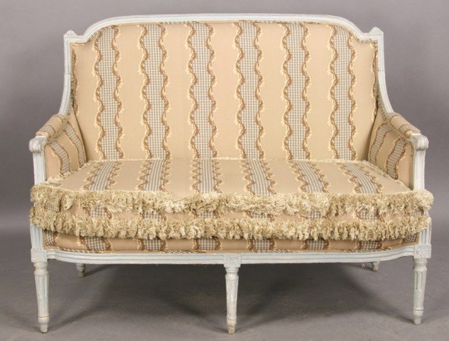 LOUIS XVI CARVED PAINT DECORATED SETTEE COUCH: Louis XVI style upholstered settee having a carved and painted frame raised on five fluted and tapered legs circa 1920. Ht: 39" Width: 51" Depth: 23"
