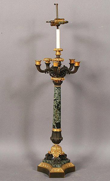French Empire gilt bronze marble candelabra form : French Empire gilt bronze and marble candelabra form lamp having four scrolling arms, a central verde marble column over acanthus leaf feet. The whole set upon a stepped base. Circa 1900. Dimensions: 