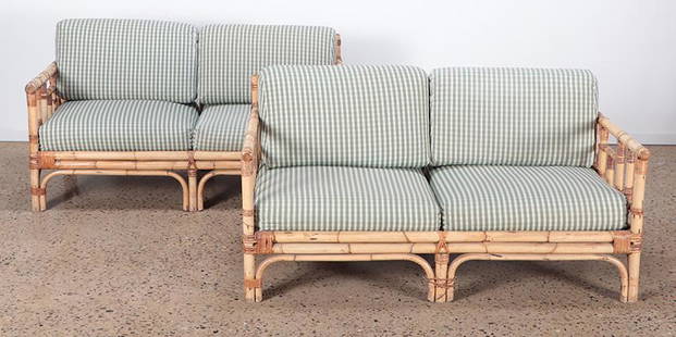 PAIR BAMBOO SETTEES C.1950: A pair of bamboo settees circa 1950 with cushions. Ht: 29" Wd: 58.25" Dpth: 32.75" Seat: 16"