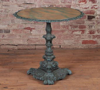 19TH C. CAST IRON TILT TOP TABLE SIGNED GROEGER: A nineteenth century cast iron tilt top table having a faux painted top. Signed Rudy Groeger. Ht: 26.75" Dia: 28.5"