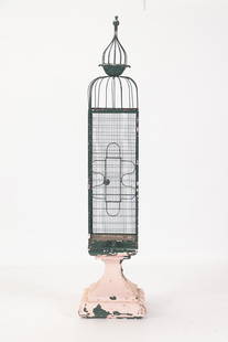 SELNDER IRON BIRD CAGE ON BASE C.1950: A slender iron bird cage on stand circa 1950. Ht: 80" Wd: 18.25" Dpth: 18.25"