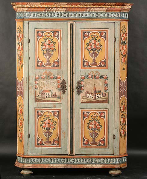 CONTINENTAL PAINT DECORATED CUPBOARD CABINET: A good Continental paint decorated cupboard having a stepped cornice over two floral and architecural paint decorated doors raised on bun feet. Ht: 74" Width: 52" Depth: 19"