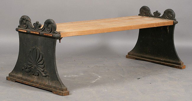 CAST IRON GARDEN BENCH WOOD SLAT SEAT MARKED: A rare cast iron foundry marked NAFVEQVARN neoclassical garden bench with wood slat seat and downswept cast iron sides circa 1930. Ht: 21" Width: 61" Depth: 26"