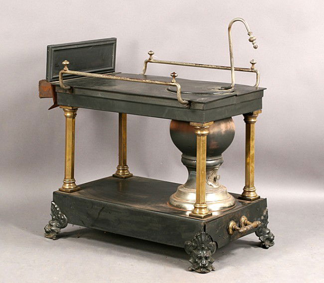 LATE VICTORIAN ANTIQUE IRON BRONZE STOVE: Late Victorian antique iron and bronze stove. Would make a great table base. Ht: 37" Width: 32" Depth: 18"