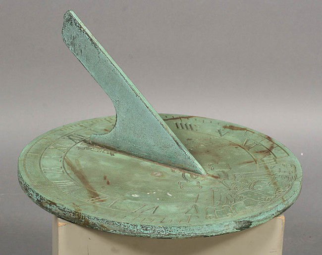 LARGE VINTAGE BRONZE SUNDIAL: A vintage large bronze sundial having incised decoration circa 1937. Width: 16.25"