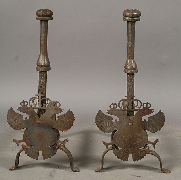 PAIR WROUGHT IRON ANDIRONS FIREPLACE: A pair of wrought iron andirons with incised decoration with applied double headed eagle circa 1890. Ht: 24.5" Width: 11.5" Depth: 19"