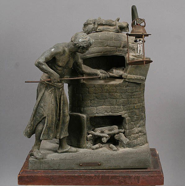 LE BOULANGER METAL SCULPTURE PARIS FOUNDRY MARK: Le Boulanger A white metal sculpture with hanging lamp. Paris foundry mark on base. Ht: 16.5" Width: 13.5" Depth: 9"