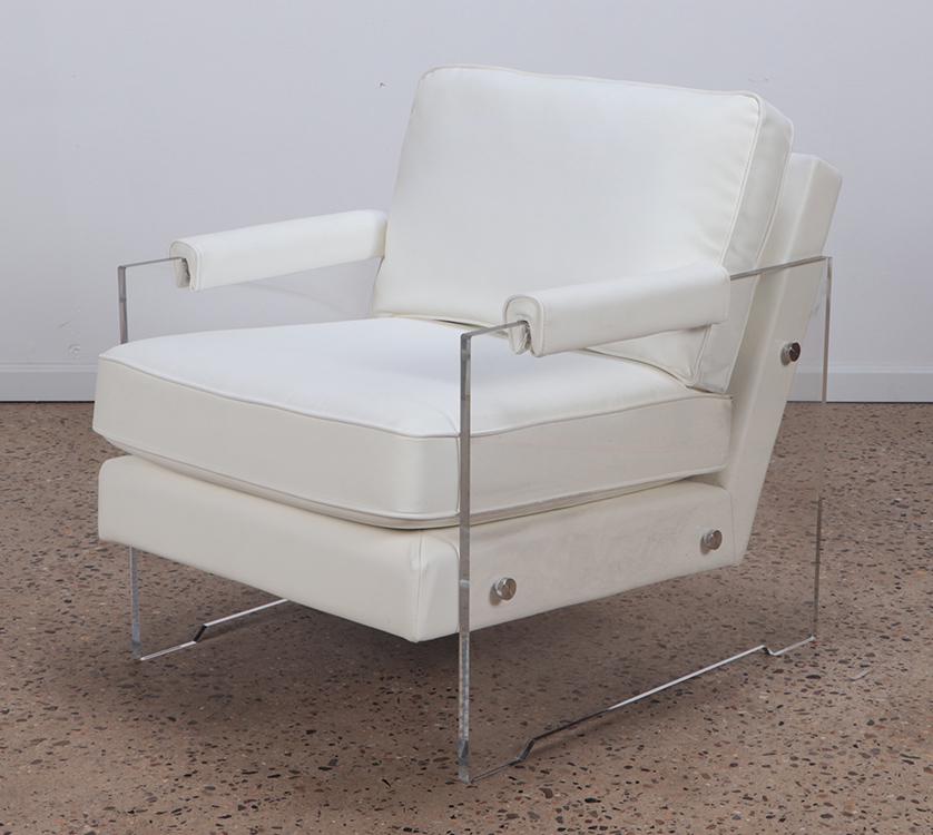 A MODERN LUCITE AND UPHOLSTERED LOUNGE CHAIR.: A modern lucite and upholstered lounge chair. Ht: 34.5" Wd: 30" Dpth: 36" Seat: 19.5"