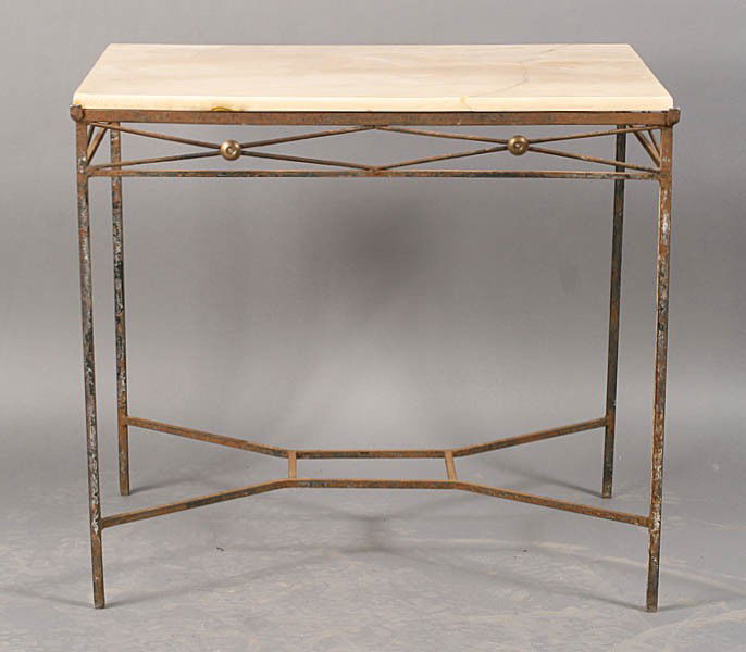 VINTAGE REGENCY GARDEN TABLE ALABASTER TOP WROUGH: A vintage Regency style garden table having an alabaster top over wrought iron base with x-form sides decorated with bronze rondels circa 1940. Ht: 28.5" Width: 31.5" Depth: 24"