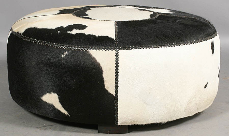 497: MODERN ROUND COWHIDE UPHOLSTERED OTTOMAN
