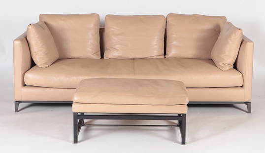 A LEATHER SOFA AND OTTOMAN BY MINOTTI: A leather sofa and ottoman by Minotti. Sofa Dimensions: 28" X 88.75" X 35.5" Seat Height: 16.75" Ottoman Dimensions: 16.75" X 37.25" X 21"