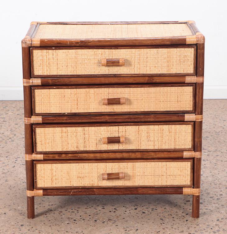 A FRENCH RATTAN FOUR DRAWER DRESSER OR NIGHT STAND: A French rattan four drawer dresser or night stand C 1960. Ht: 29.75" Wd: 28" Dpth: 16"