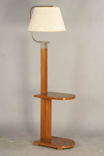 TIERED MAHOGANY BRASS LAMP STAND: A two-tiered lamp stand made of mahogany having brass cap and arm circa 1940. Ht: 66" Width: 13" Depth: 18"