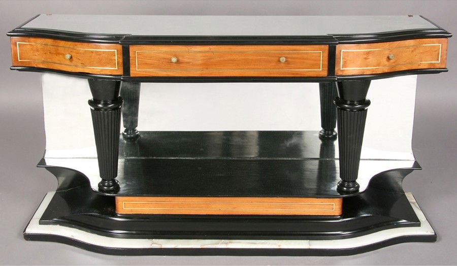 EBONIZED VINTAGE MIRRORED ALABASTER CONSOLE: Art Deco ebonized console table having an inset mirrored top, three brass inlaid drawers and reeded and tapered legs circa 1930. The whole on a shaped base with alabaster trim. Ht: 30" Width: 55" Dept