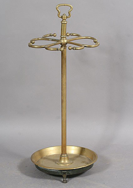FRENCH BRONZE UMBRELLA STAND SHALLOW BOWL BASE: A French bronze umbrella stand having a central support and shallow bowl base, raised on stylized feet circa 1920. Ht: 34" Dia: 13.5"