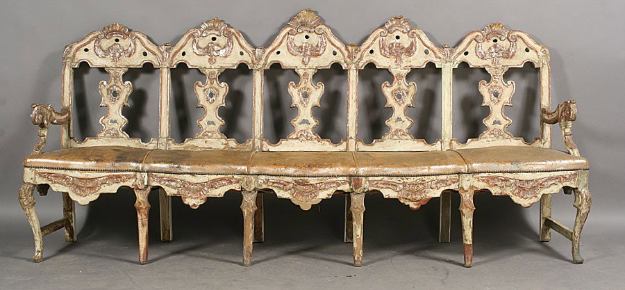 ANTIQUE ITALIAN SETTEE SILVER GILT LEATHER C.1820: An intriguing antique Italian overscaled settee having five repeating silver gilt and polychromed chair backs and five leather seats circa 1820. Supported on twelve legs. Ht: 41" Width: 93" Depth: 18"