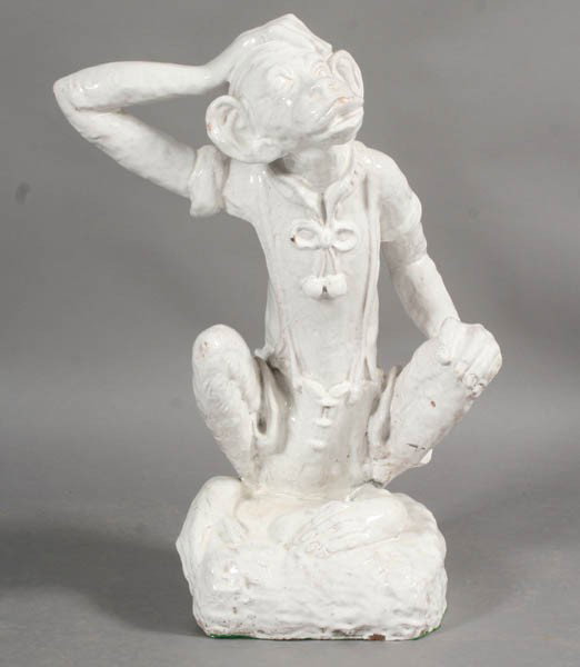VINTAGE GLAZE TERRACOTTA SEATED MONKEY: A striking vintage glazed terracotta seated monkey with shorts and shirt raised on rustic base circa 1860. Ht: 26.5" Width: 21" Depth: 11"