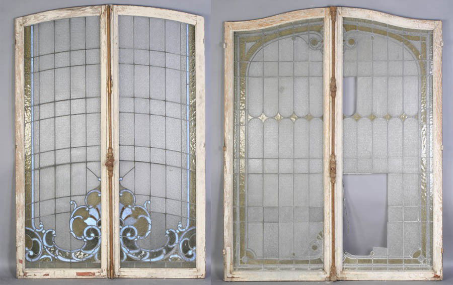 4 PIECE LOT STAINED GLASS WINDOWS SHAPED TOP: Four piece lot of stained glass windows, each having a shaped top and original wood frame circa 1910. Two with scroll decoration, the other two with geometric glass pattern. Ht: 78.5" Width: 28"