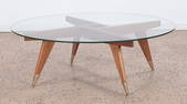 A WOOD AND GLASS COFFEE TABLE IN THE MANNER OF GIO