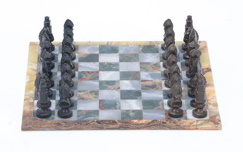 ANTIQUE CHESS SET C.1920 ONYX BOARD SPELTER PIECES: An antique chess set circa 1920 having onyx board and spelter pieces. Ht: 4" Wd: 17.25" Dpth: 17.25" (board)