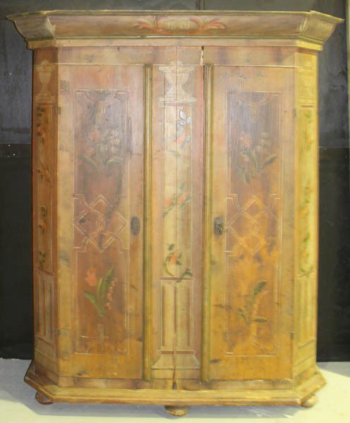 19TH C. SCANDINAVIAN PAINTED CUPBOARD: A Scandinavian or German antique painted cupboard with stepped cornice dated 1801 having two decorated doors and bun feet. Ht: 75.5" Width: 60" Depth: 19"