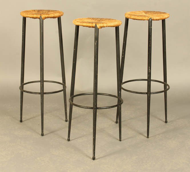 SET 3 VINTAGE WROUGHT IRON BAR STOOLS C.1950: Set of three vintage wrought iron bar stools each having rush seats and tapered legs circa 1950. Ht: 30" Dia: 13"