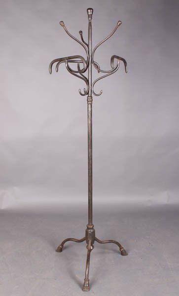 VINTAGE WROUGHT CAST IRON HAT COAT RACK: A vintage wrought and cast iron hat and coat rack with paw feet circa 1920. Ht: 74.5" Width: 22" Depth: 22"