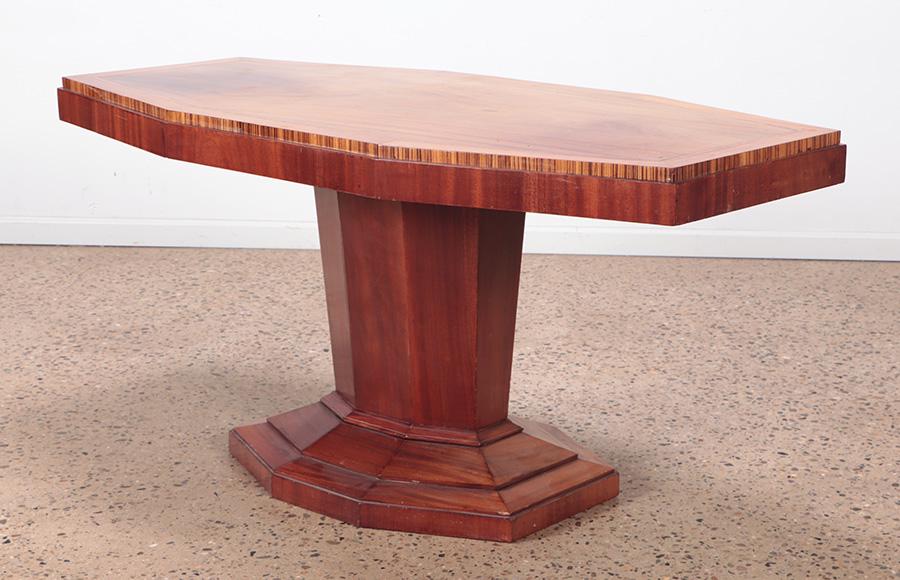 An unusual mahogany Art Deco pedestal table with macassar trim C 1930. Ht: 30" Wd: 62.75" Dpth: 31" (1 of 5)