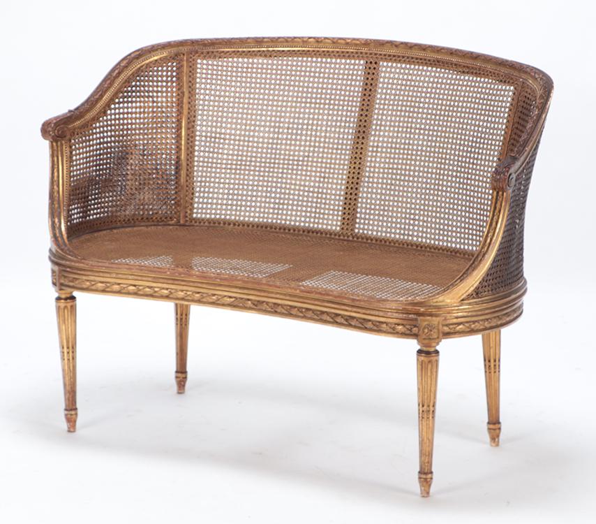 FRENCH LOUIS XVI STYLE GILT WOOD AND CARVED CAIN SETTEE C 1900. (1 of 5)