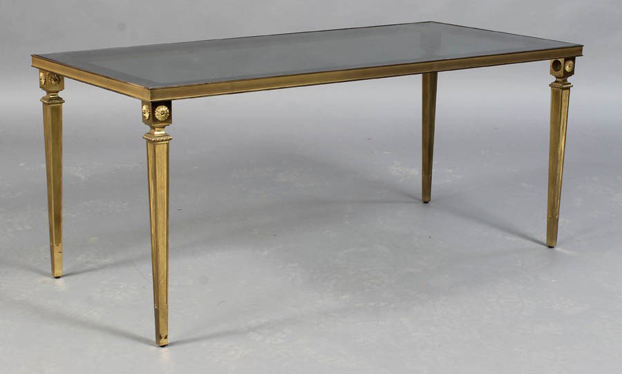 BRONZE DIRECTOIRE STYLE COFFEE TABLE C.1950: Bronze Directoire style coffee table having mirror banded glass top supported on tapered legs with corner rosettes circa 1950. Ht: 20" Width: 43" Depth: 19"
