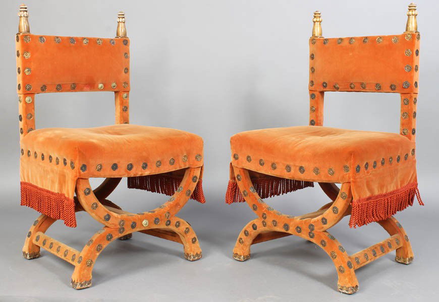 PR ANTIQUE CONTINENTAL VELVET GILTWOOD CHAIRS: Pair of Continental velvet upholstered side chairs having giltwood carved turned finials over a fitted seats on curule-form bases circa 1910. Ht: 39.5" Width: 22.5" Depth: 20"