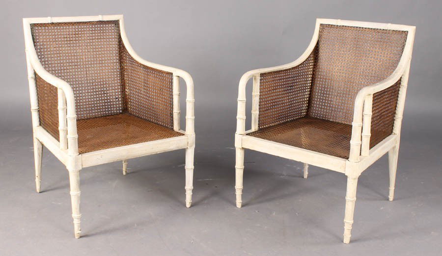 PR ANTIQUE REGENCY PAINTED FAUX BAMBOO ARMCHAIRS: Pair of antique Regency painted armchairs having faux bamboo frames and caned backs and seats circa 1890. Ht: 32.5" Width: 23" Depth: 21.5"