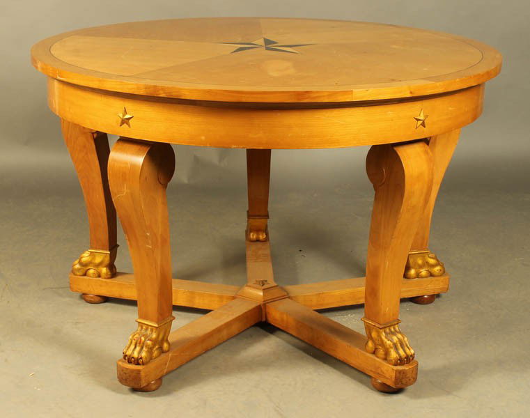 NEOCLASSICAL STYLE INLAID CENTER TABLE: Neoclassical style sycamore center table with inlaid top, cabriole legs, stylized gilt paw feet and star shaped stretcher circa 1940. Ht: 31" Dia: 47.5"
