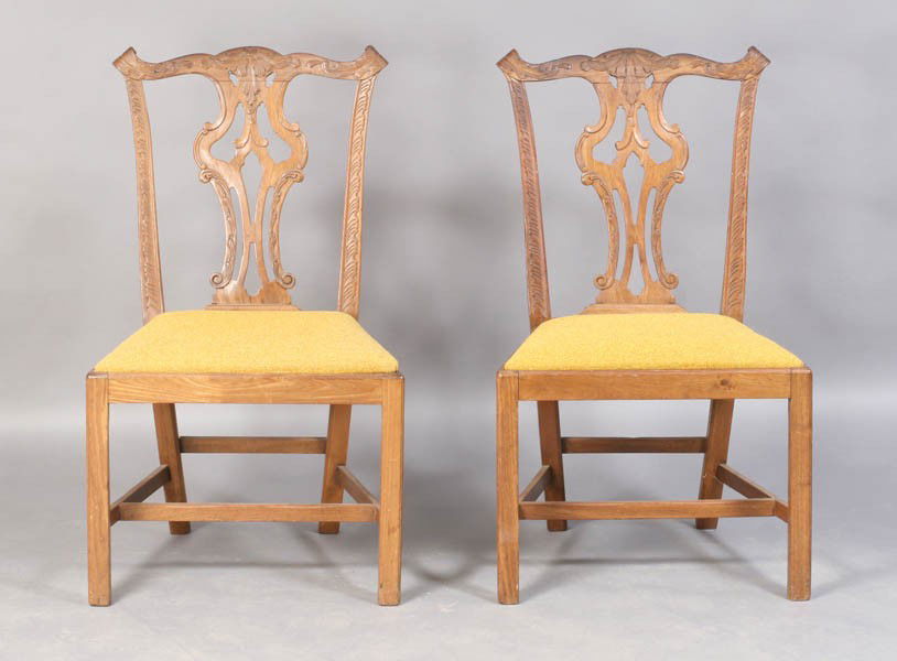 PR IRISH CHIPPENDALE ANTIQUE SIDE CHAIRS: Pair of Irish Chippendale side chairs having elaborately carved crest rails and open back splats and slip seats. With chamfered legs and H-stretchers. Ht: 37" Width: 22" Depth: 18"