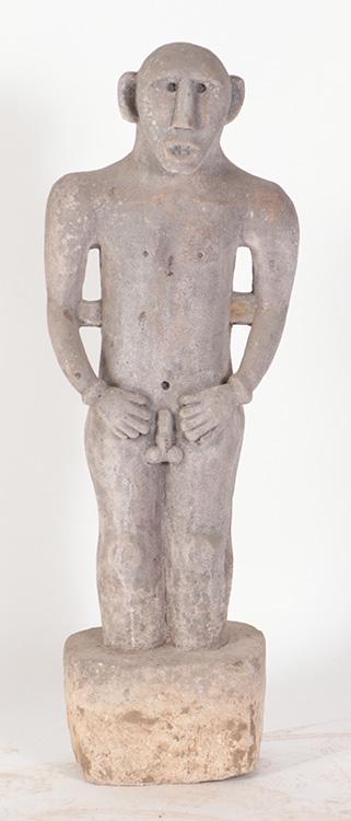 A STONE STATUE OF A PRIMITIVE MALE FIGURE RAISED ON PLINTH BASE. (1 of 5)