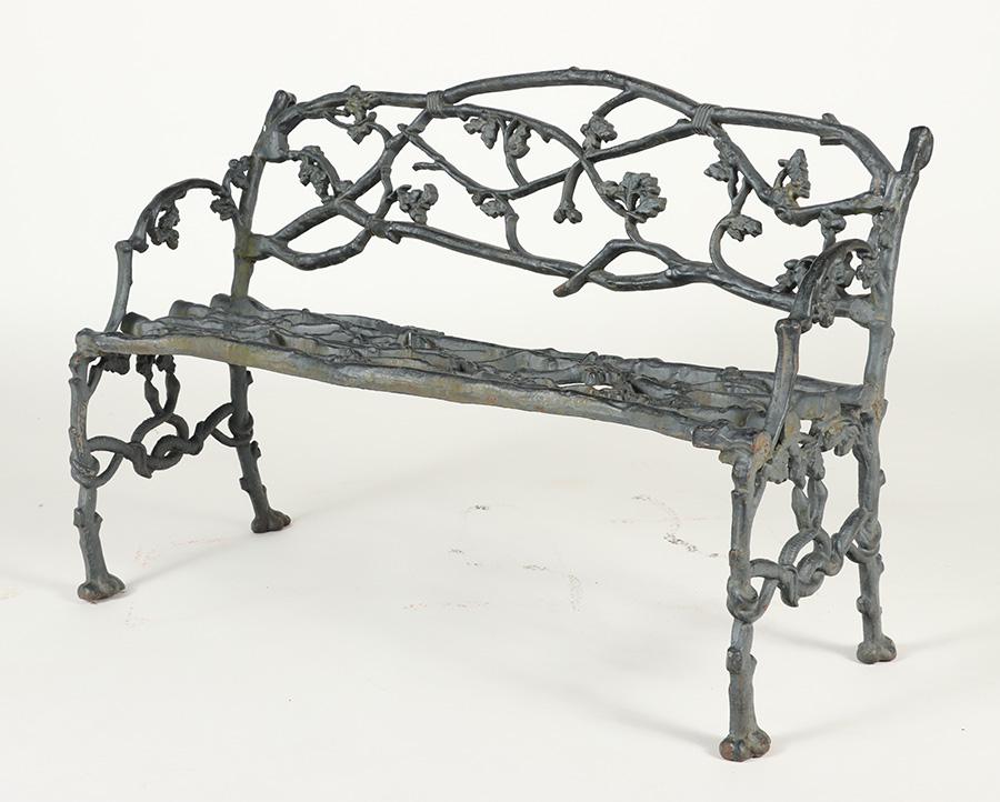 A CAST IRON TWIG FORM GARDEN BENCH. (1 of 7)