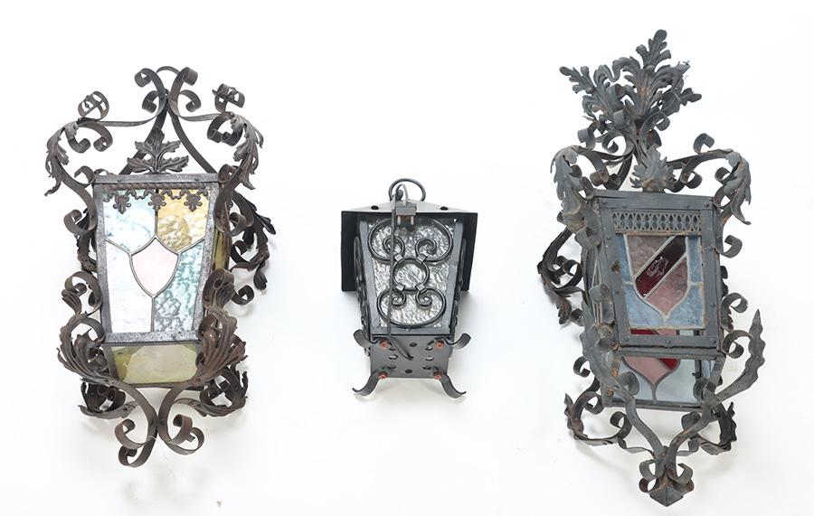 TWO FRENCH SCROLL FORM IRON LANTERNS C 1940 TOGETHER WITH A LATER VERSION.: Two French scroll form iron lanterns C 1940 together with a later version. Dimensions Largest: 30" X 15" Dimensions Smallest: 12.5" X 7.5"
