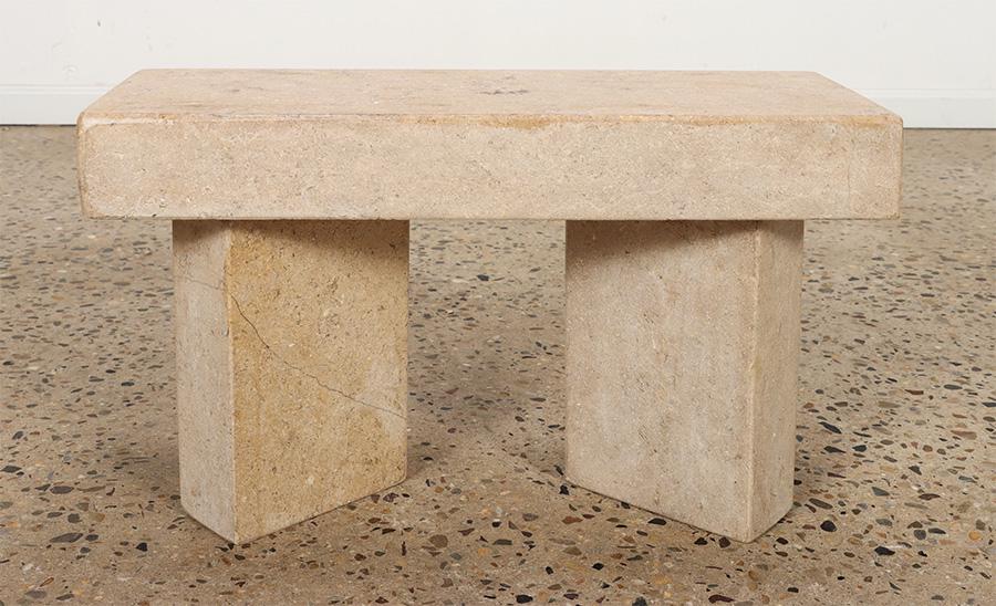 A SMALL TRAVERTINE MODERNIST GARDEN BENCH: A small travertine modernist garden bench. Ht: 14.25" Wd: 23.5" Dpth: 9"