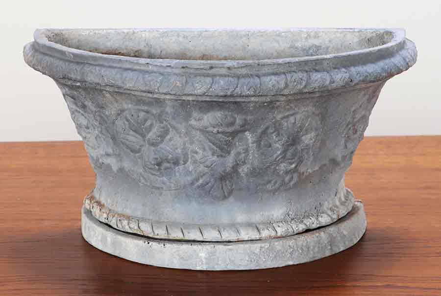A CAST LEAD  PLANTER WITH FIGURAL DECORATION. (1 of 5)