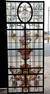 LARGE LEADED AND PAINTED GLASS WINDOW DEPICTING AN