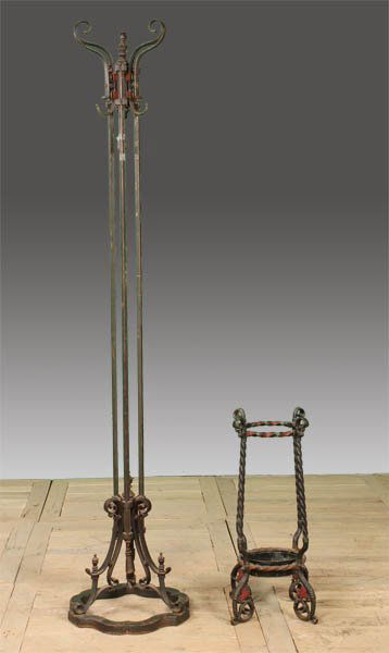 2 PC CAST WROUGHT IRON COAT RACK UMBRELLA STAND: A very good two piece lot of cast and wrought iron furniture to include a standing coat rack, and an Art Nouveau umbrella stand circa 1915. The coat rack with elegant scrolling hooks and a drop tassel