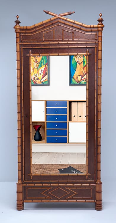 FRENCH BIRDSEYE MAPLE AND FAUX BAMBOO SINGLE DOOR ARMOIRE WITH DRAWER BELOW AND ADJUSTABLE SHELVES C: French birdseye maple and faux bamboo single door armoire with drawer below and adjustable shelves C 1880. Ht: 91.75" Wd: 40" Dpth: 17.5"