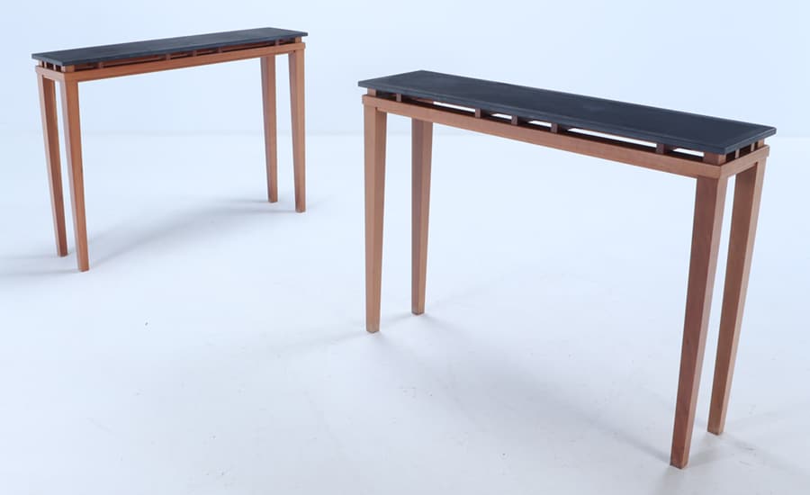 A PAIR OF CUSTOM MADE CONSOLE TABLES WITH FLOATING SLATE TOPS.: A pair of custom made console tables with floating slate tops. Ht: 35.5" Wd: 48" Dpth: 12"